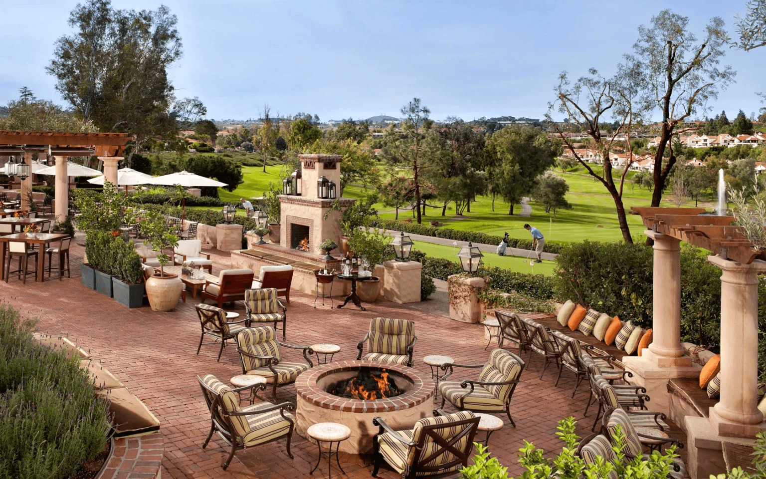 Beautiful garden with chairs and fireplace